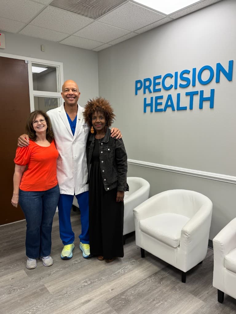 Dr. Brown with patients at Precision Health office